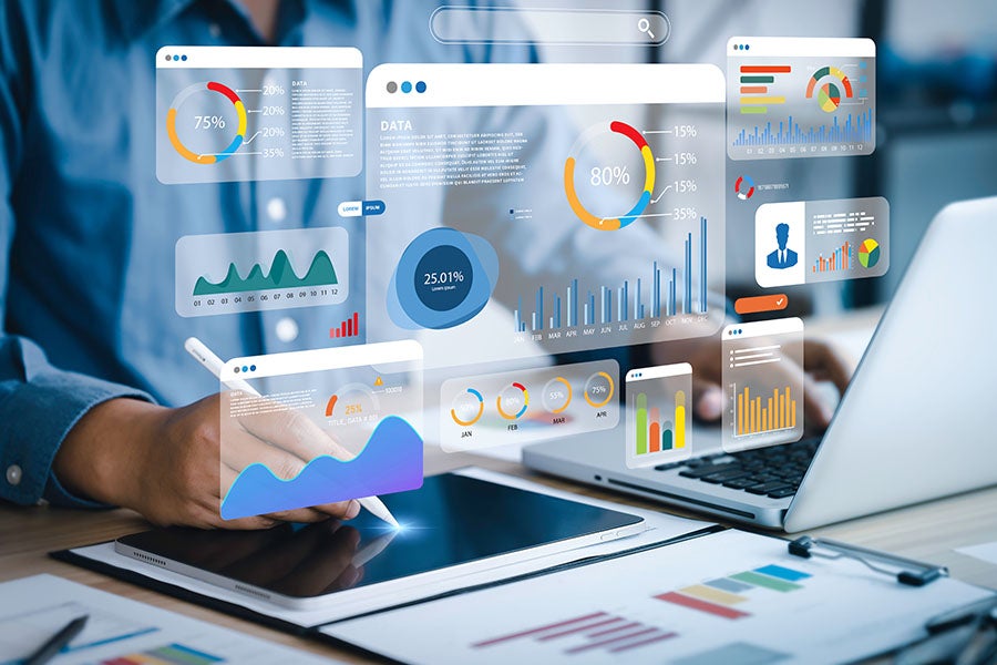 An analyst uses a computer and dashboard for data business analysis and Data Management System.