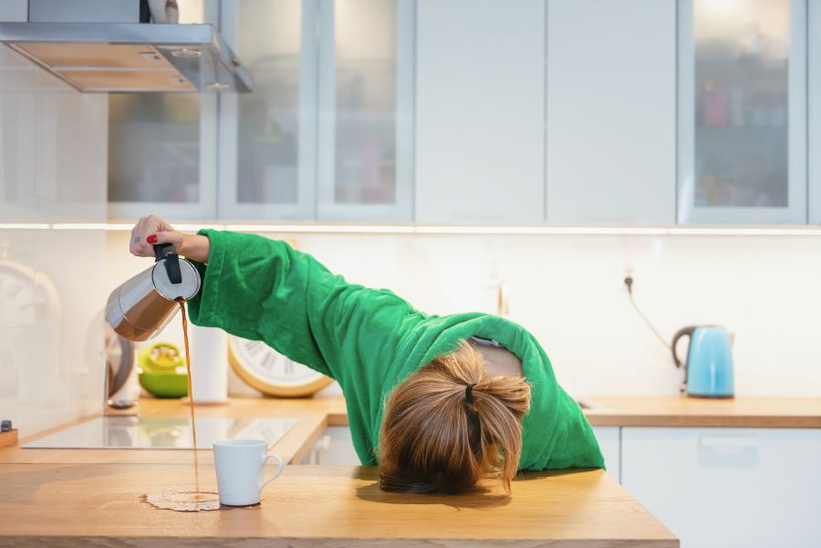 Tired woman sleeping on the table.