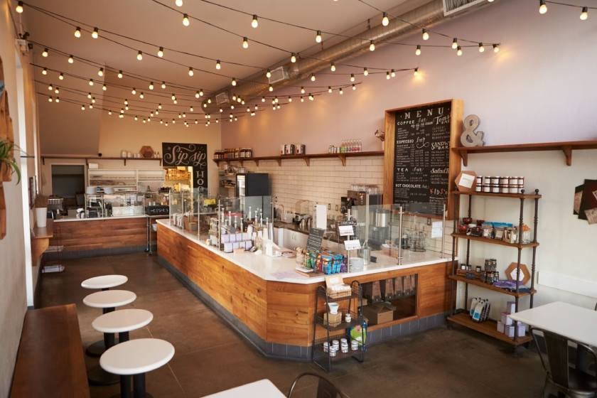 Empty coffee shop interior, daytime.