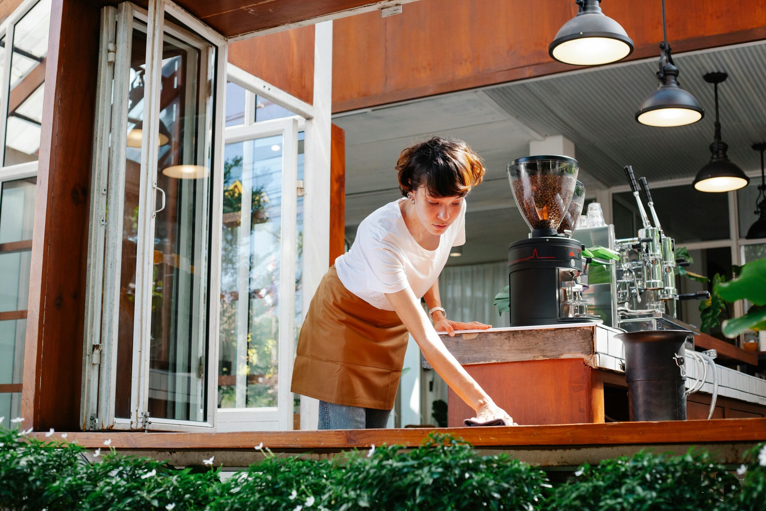 Restaurant worker wiping tables