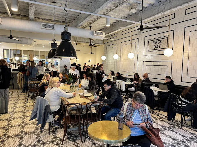 Tatte Bakery, a large coffee shop in Boston, using its space to accommodate dine-in patrons.