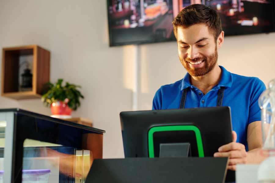 Coffeeshop barista working on POS